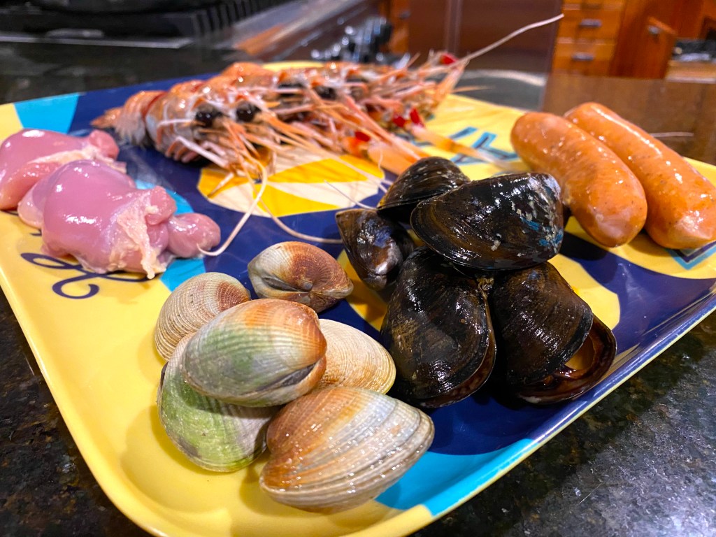 This image has an empty alt attribute; its file name is 83f2e-paella-seafood-and-meat-1024x768-1.jpeg